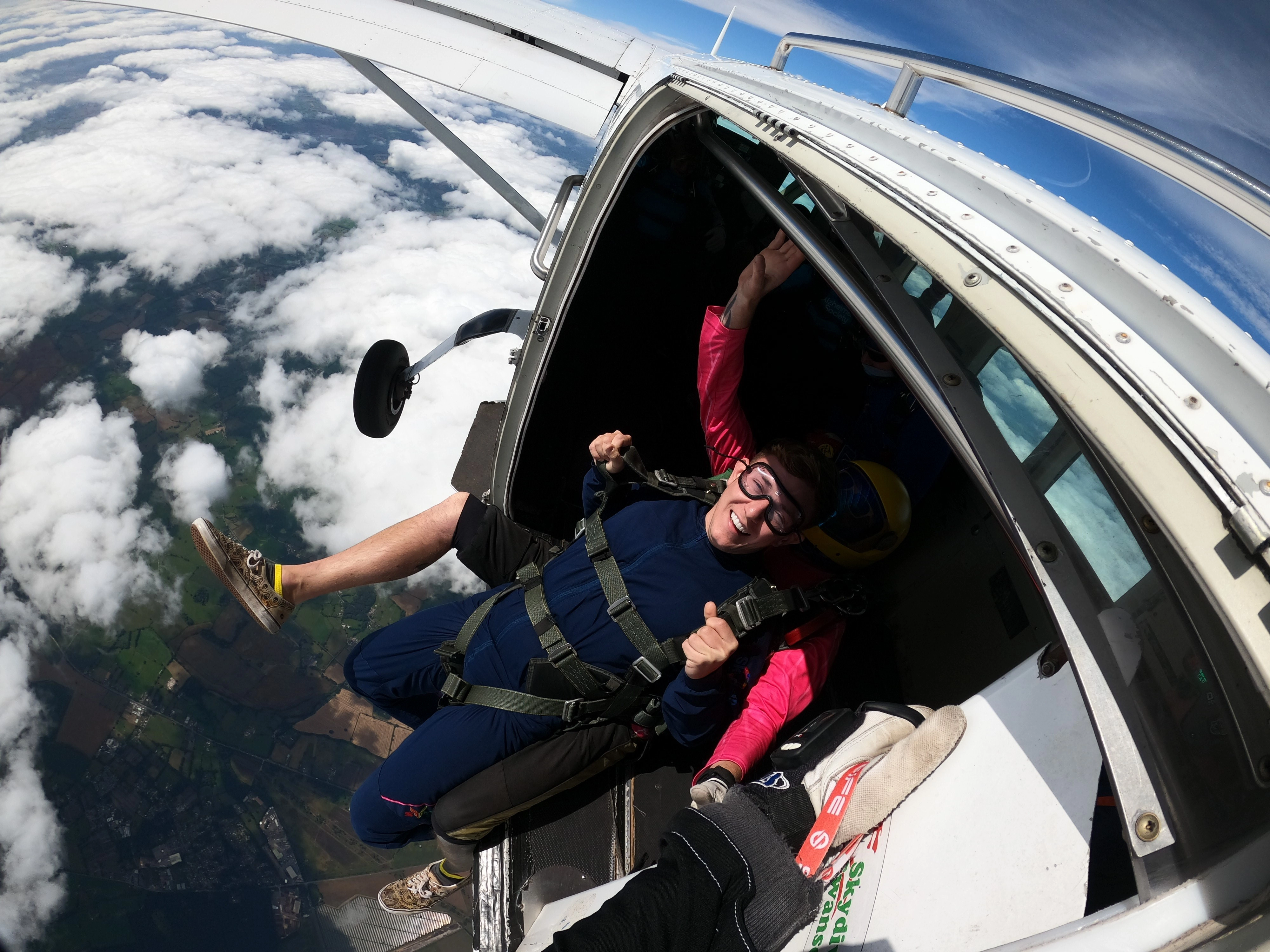 A photo of a St. Rocco's supporter jumping out of a plane for their skydive