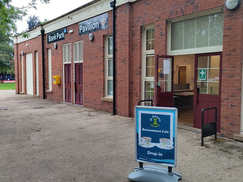 The Brick Bank Park Pavilion with a St. Rocco's Bereavement Cafe sign outside