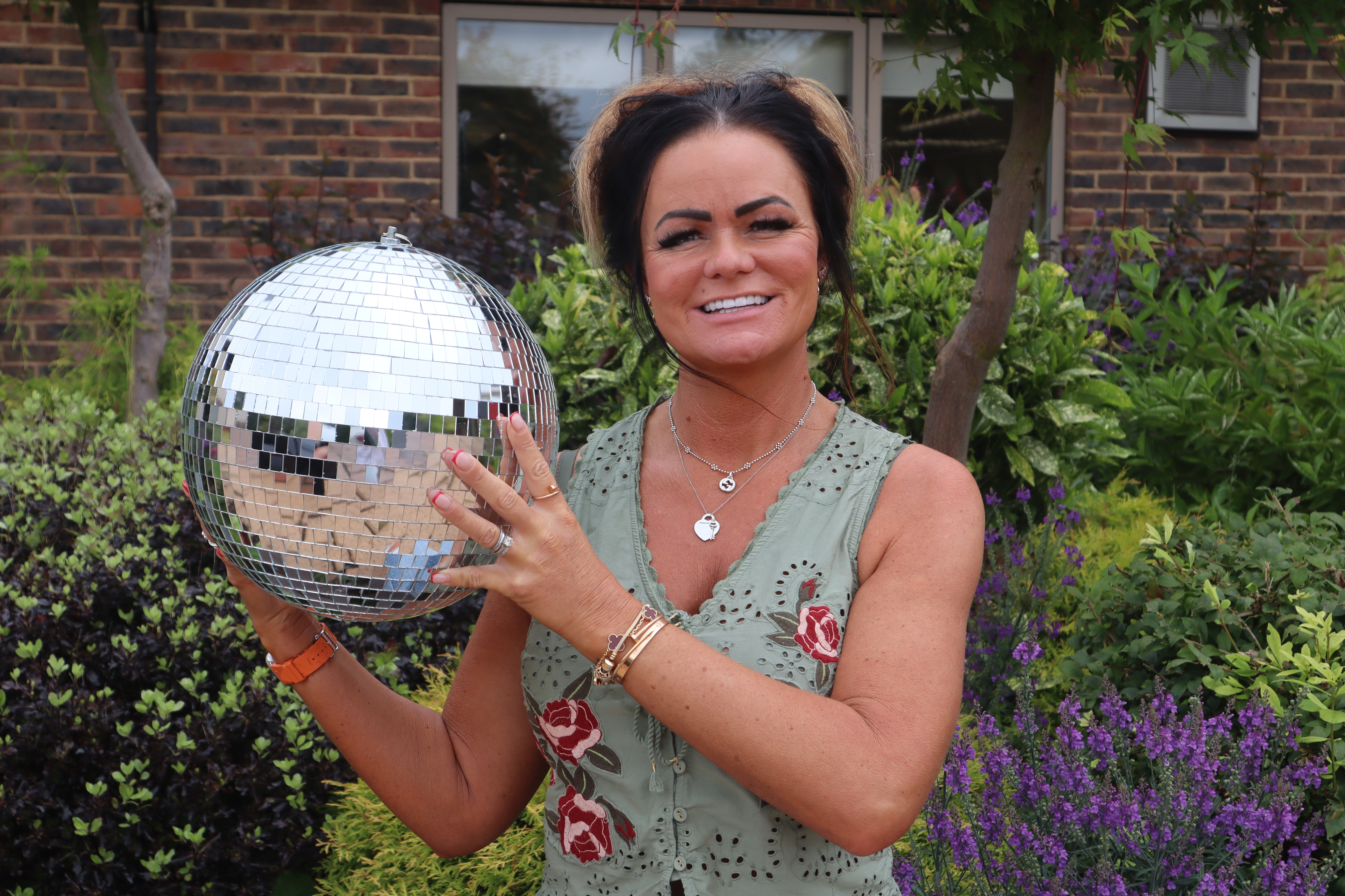 A photo of Elsa holding the Strictly St. Rocco's Glitter ball